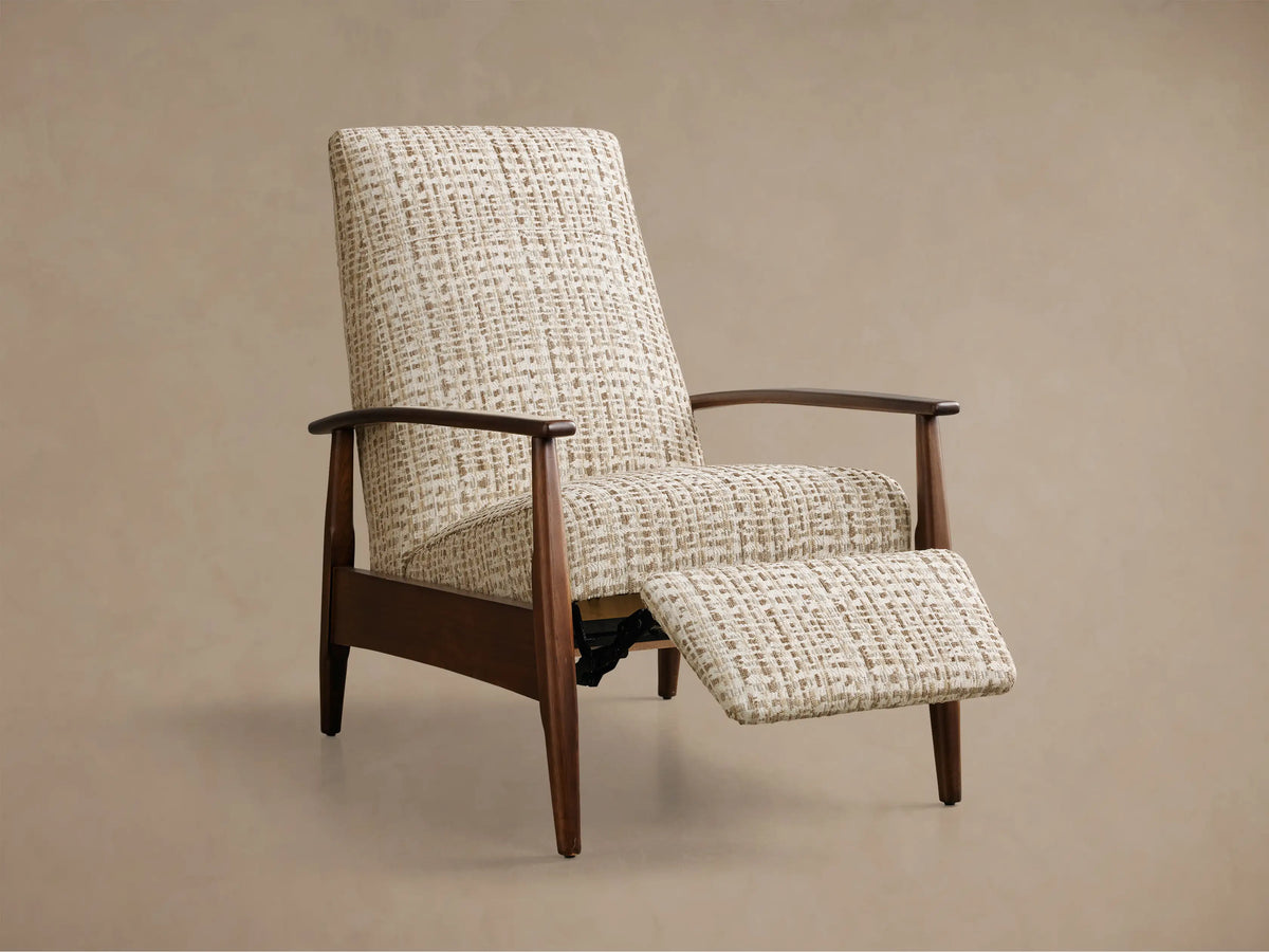 Mid-century recliner chair with light brown and cream textured upholstery, dark wood frame, and an extended footrest.