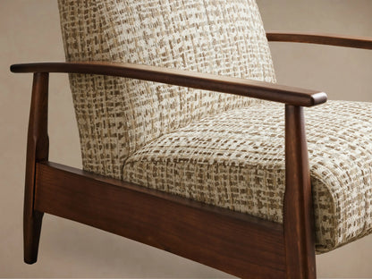 Close-up of beige and brown textured weave pattern on an armchair with dark wooden armrests and frame, angled.
