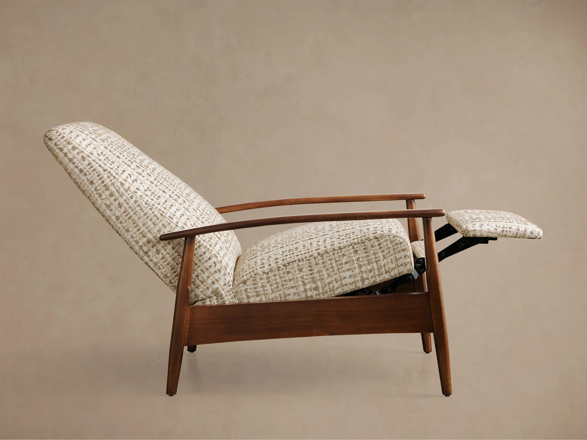 Front view of a high-backed armchair with textured cream and beige woven upholstery and dark wood frame with light wood armrest caps.