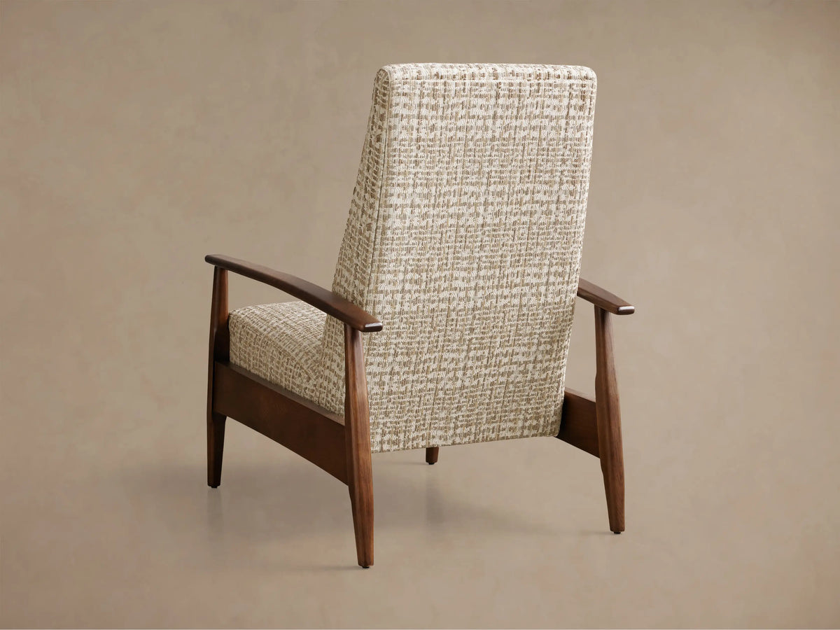 Side view of a recliner chair with a dark brown wooden frame and cream woven fabric upholstery, footrest extended.