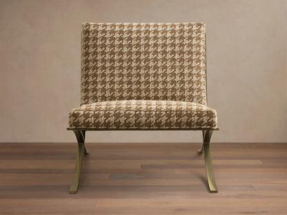 Front view of the Moxie Chair with brown and beige houndstooth upholstery and gold-toned finished stainless steel X-legs.