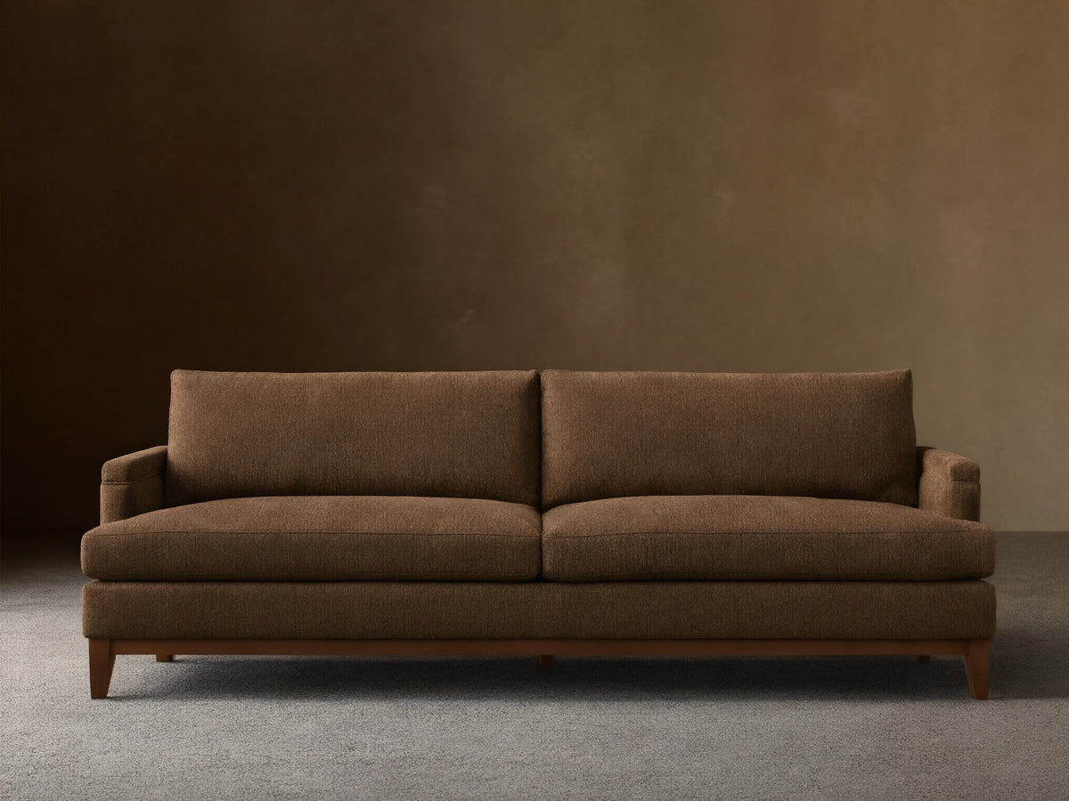 Front view of the brown textured fabric Hunter Sofa with a visible wooden base and tapered legs.