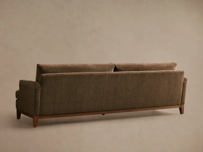 Close-up, angled view of the brown Hunter Sofa, featuring textured fabric on the seat, back, armrest, and a wooden base.