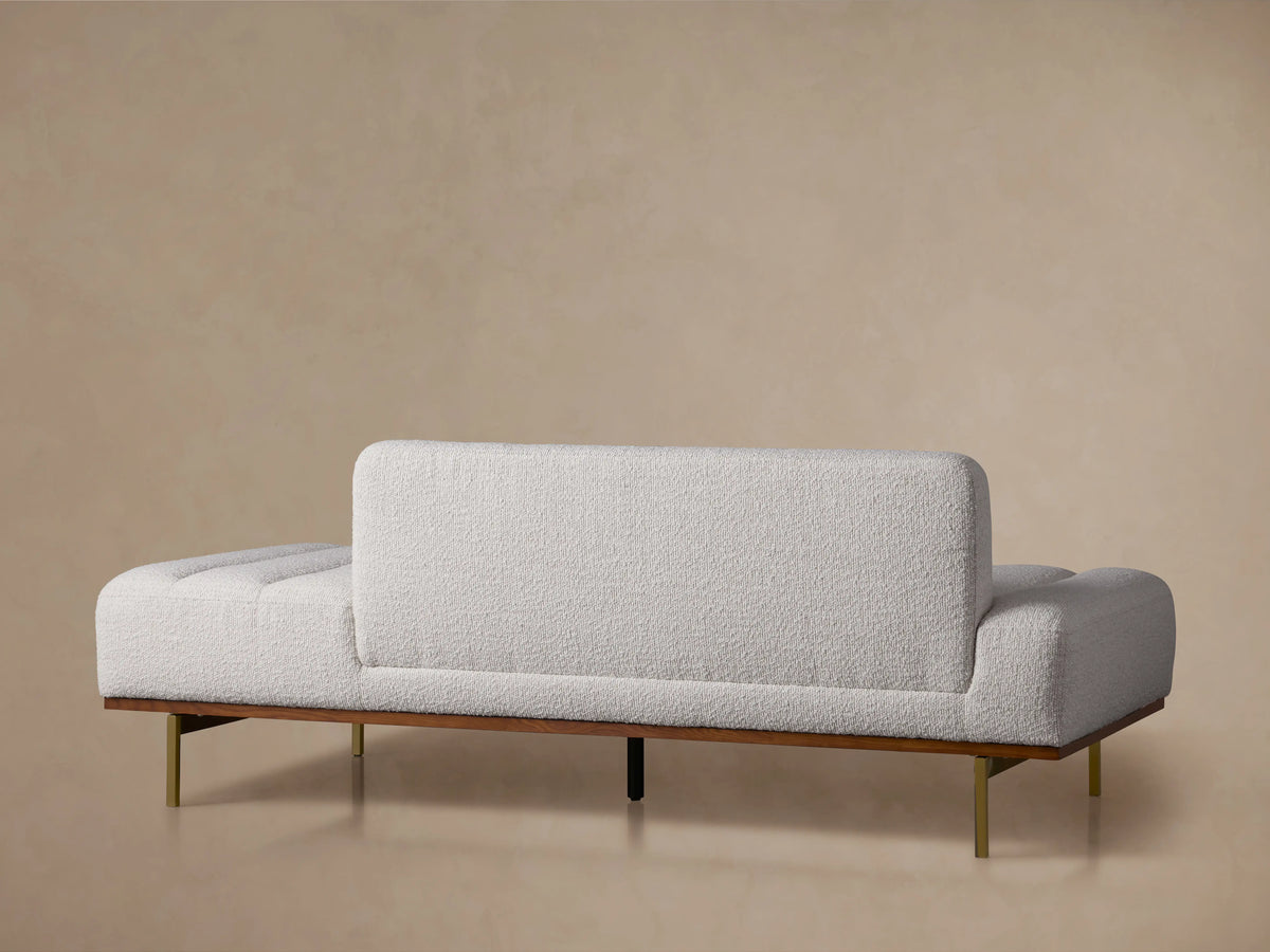 Lansing Daybed with Merino Pearl fabric features a textured surface, vertical tufting, wooden legs, and a soft cushioned back.