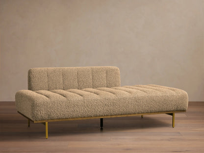 Front view of light brown bouclé Lansing Daybed with vertical channel tufting and gold-toned metal frame.