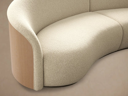 Front view of cream Caden Two-Piece Sectional, curved with textured fabric, sand veneer, and brushed nickel plinths.