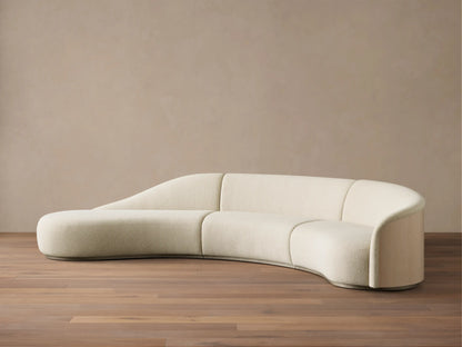 Front view of the Cream Caden Three-Piece Bumper Sectional, featuring a curved design with an extended bumper on the left.