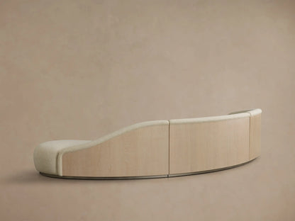 Front view of the Cream Caden Three-Piece Bumper Sectional, showcasing its curved, modular design with three connected pieces.
