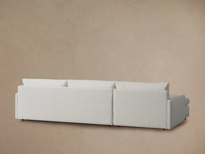 Kipton Two-Piece Chaise Sectional in light fabric, featuring a plush, cushioned seat and backrest with an armrest on the right side.