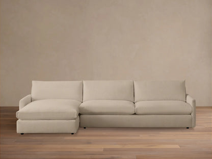 Kipton Two-Piece Chaise Sectional in a neutral beige fabric, featuring a left-side chaise and right-side loveseat on a wooden floor.