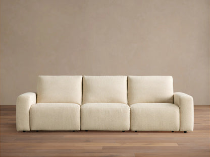 Brennan Three-Piece Motion Sofa, light cream textured fabric, modern design with blocky arms & cushions, on wood floor.