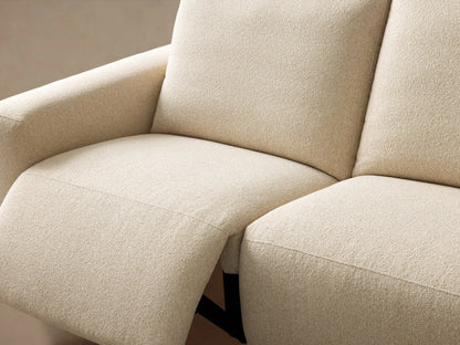Cream Brennan Three-Piece Motion Sofa, textured fabric, modern blocky design. Three modular sections against a light beige wall.