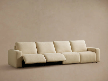 Brennan Motion Sectional: Close-up of two dark gray control buttons on light beige textured fabric, with black trim.
