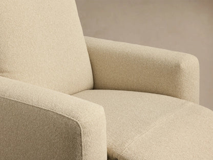 Brennan Motion Recliner, cream textured fabric, full front view. High back, wide arms, on wood floor against beige wall.