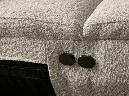 Front view of the light beige Fia Two-Piece Motion Sofa, with two seats, rounded arms, and distinct headrests.