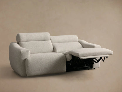 Rear view of light beige Fia Two-Piece Motion Sofa, showing two back sections with textured performance fabric.