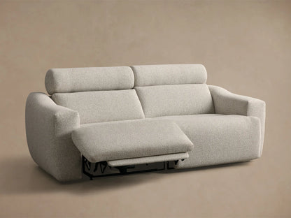Front view of the pale gray textured Fia Two-Piece Motion Sofa, with the right footrest fully extended.