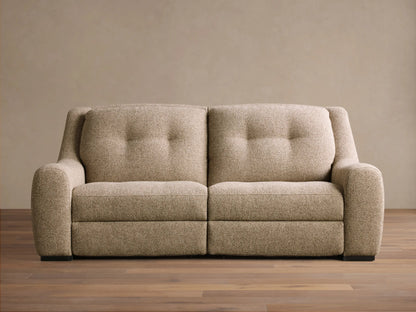 Front view of the light brown speckled Perry Two-Piece Motion Sofa with two tufted backrests and rounded arms.
