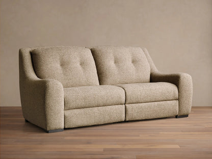 Front view of the light brown speckled Perry Two-Piece Motion Sofa with two tufted backrests and rounded arms.