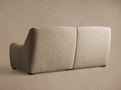 Close-up of three black oval motion control buttons embedded in the beige textured upholstery of the Perry Two-Piece Motion Sofa.