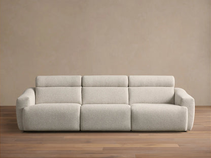 Front view of the light gray Fia Three-Piece Motion Sofa with integrated headrests and textured upholstery.