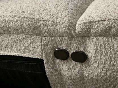 Front view of the light grey textured Fia Three-Piece Motion Sofa, featuring three distinct seats with integrated headrests and gently curved arms.