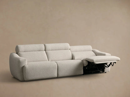 Rear view of the light beige Fia Three-Piece Motion Sofa, showing its three individual seat and back cushions.