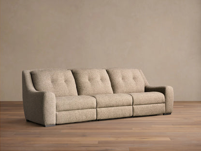 Front view of the light beige textured Perry Three-Piece Motion Sofa, featuring three seats with button-tufted back cushions.