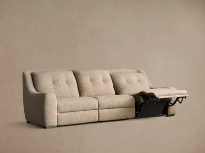 Rear view of the light beige upholstered Perry Three-Piece Motion Sofa, showing its three distinct back sections.