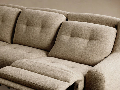 Close-up of the three dark grey motion control buttons on the light beige textured fabric of the Perry Four-Piece Motion Sectional™.