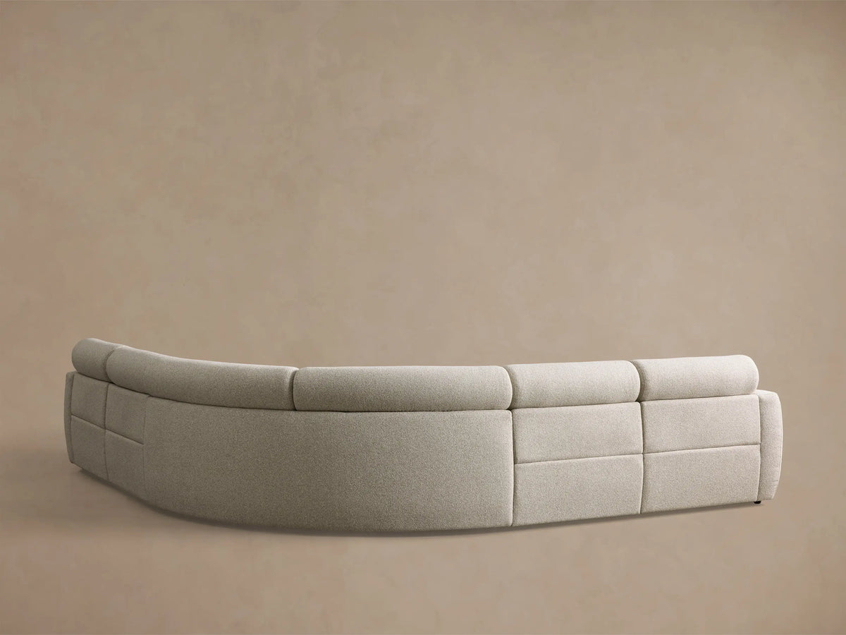 Close-up of a cream Fia Five-Piece Motion Corner Sectional, showing a textured fabric and an extended footrest.