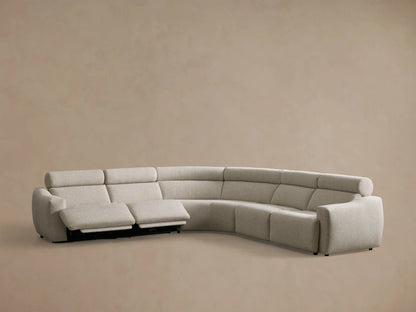 Rear view of the light beige Fia Five-Piece Motion Corner Sectional, showing its curved back with segmented cushions.