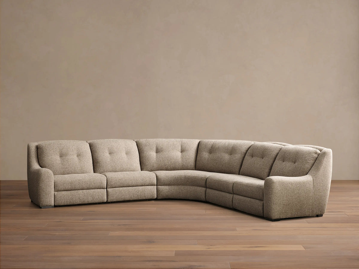 Front view of the light beige heathered L-shaped Perry Five-Piece Motion Corner Sectional with button-tufted backs.