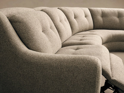 Close-up of three dark gray motion controls embedded in the light textured fabric of the Perry Five-Piece Motion Corner Sectional.