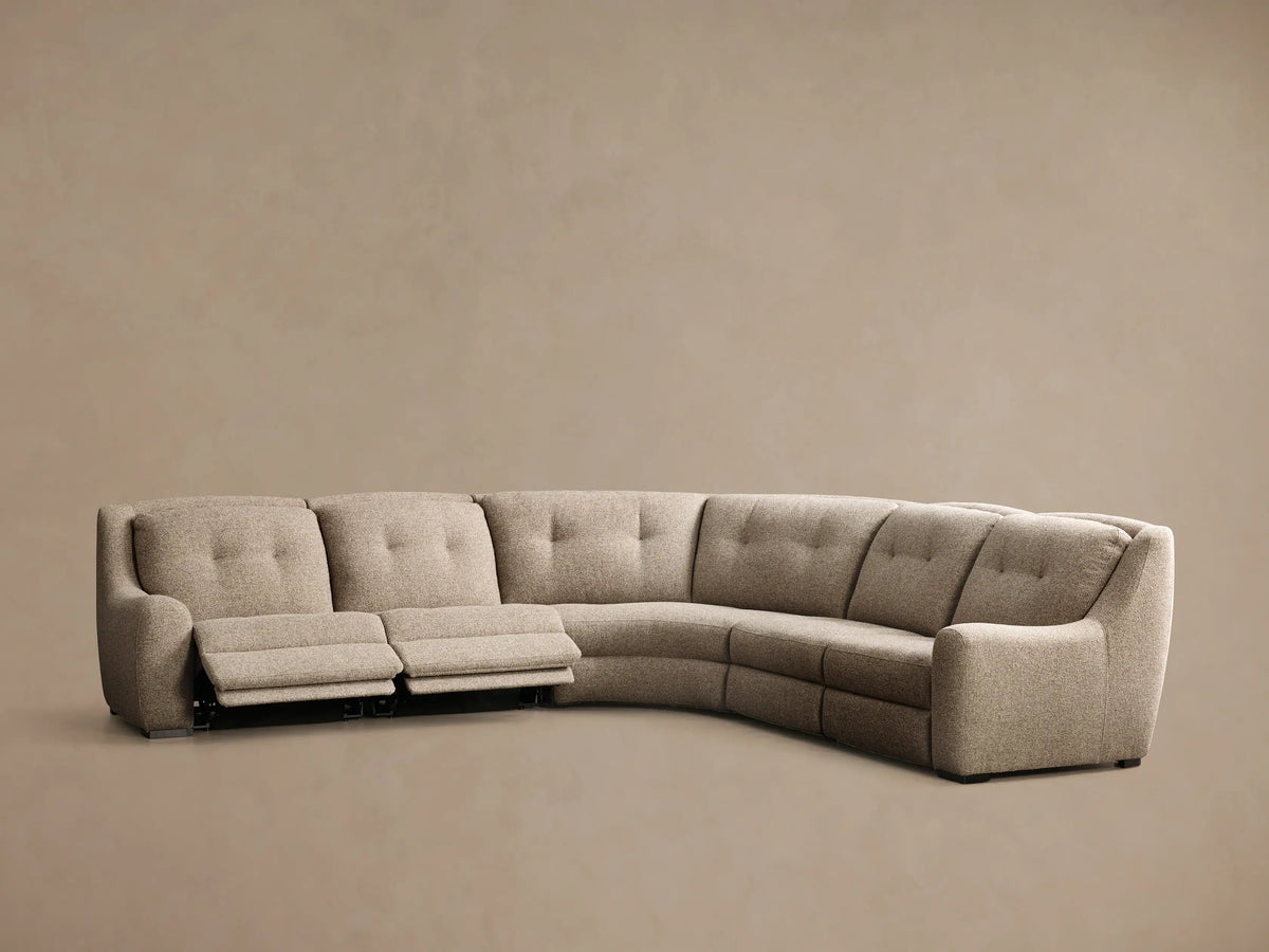 Front view of the oatmeal Perry Five-Piece Motion Corner Sectional with its right-arm recliner extended.
