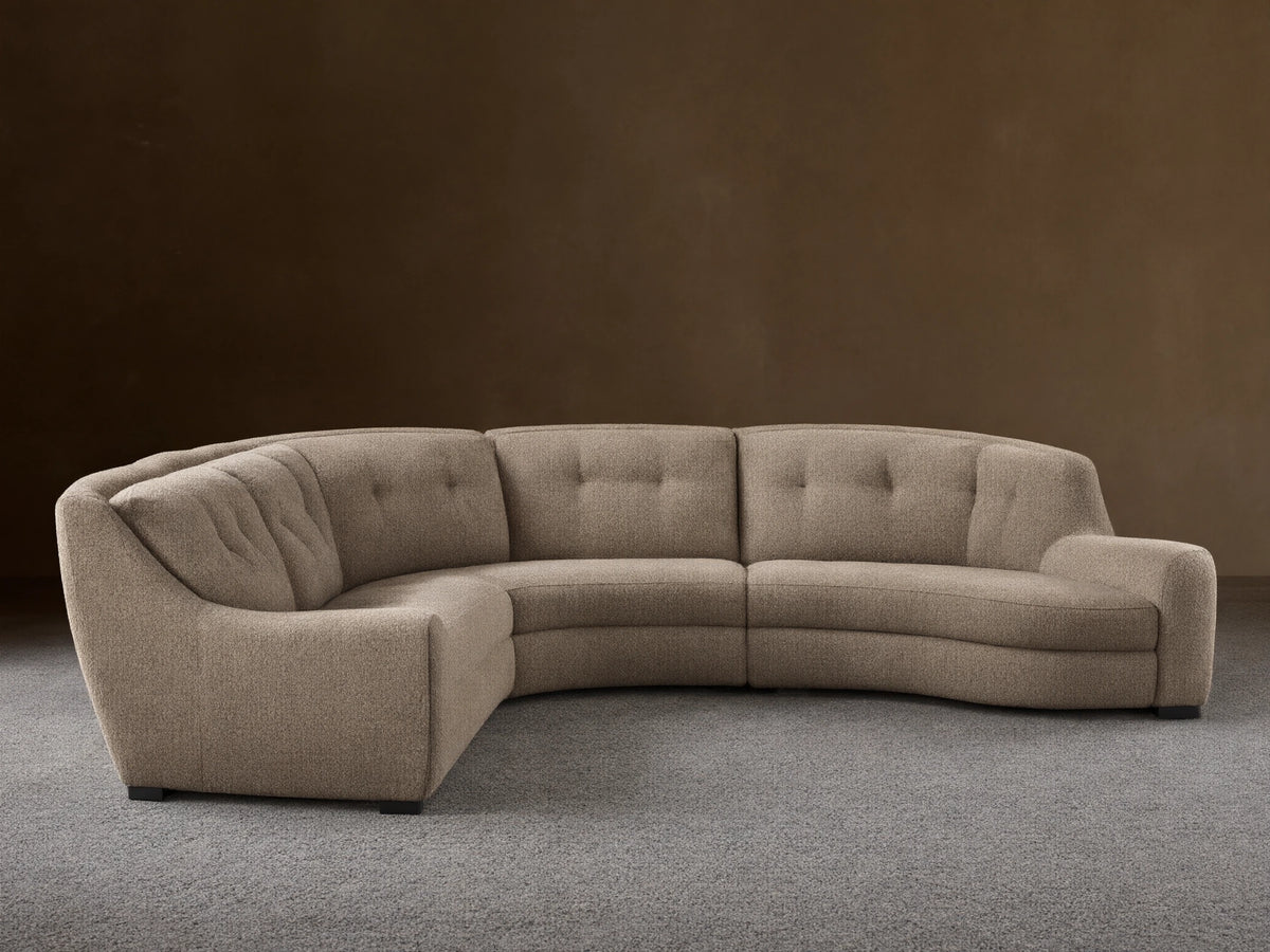 Front view of the light beige heathered L-shaped Perry Five-Piece Motion Corner Sectional with button-tufted backs.