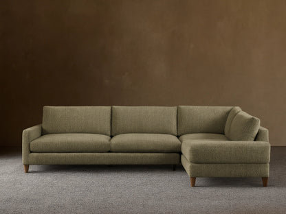 Front view of the L-shaped Kipton Slim Arm Elevated Two-Piece Sectional, upholstered in olive green patterned fabric, with slim arms and mocha feet.