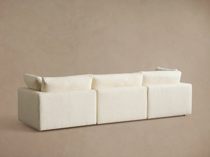 Plush, creamy off-white Beale Modular Sofa, close-up of left armrest and two textured seat cushions.