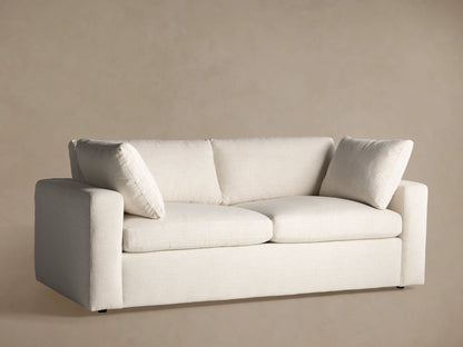 Front view of the light off-white Beale Sofa, featuring two seat cushions, two back cushions, and two arm pillows.