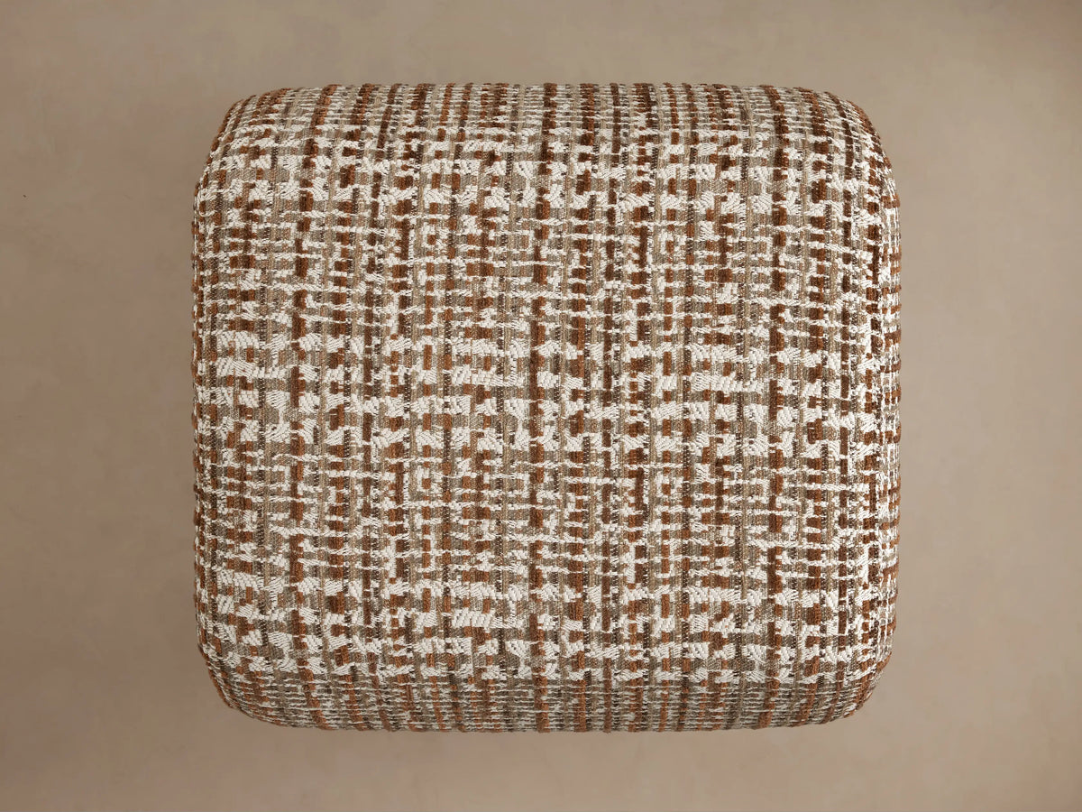 Textured ottoman with a brown and white woven pattern, showcasing a rectangular shape with a detailed close-up of the fabric design.
