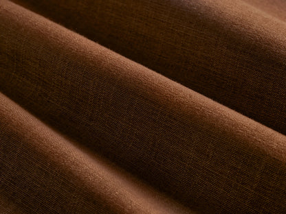 Close-up of the brown woven fabric on the McKinley Sofa with Fringe.
