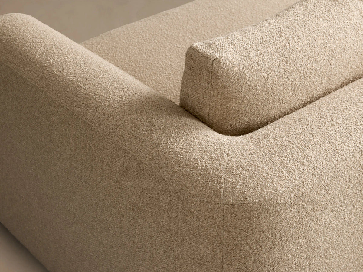 Front view of the beige Stiles Three-Piece Modular Sofa, featuring rounded arms and deep, plush cushions.