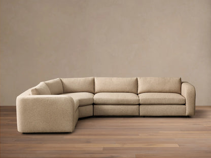 Front view of a light beige Stiles Four-Piece Sectional™ in an L-shape, with left arm, corner, armless, and right arm units.