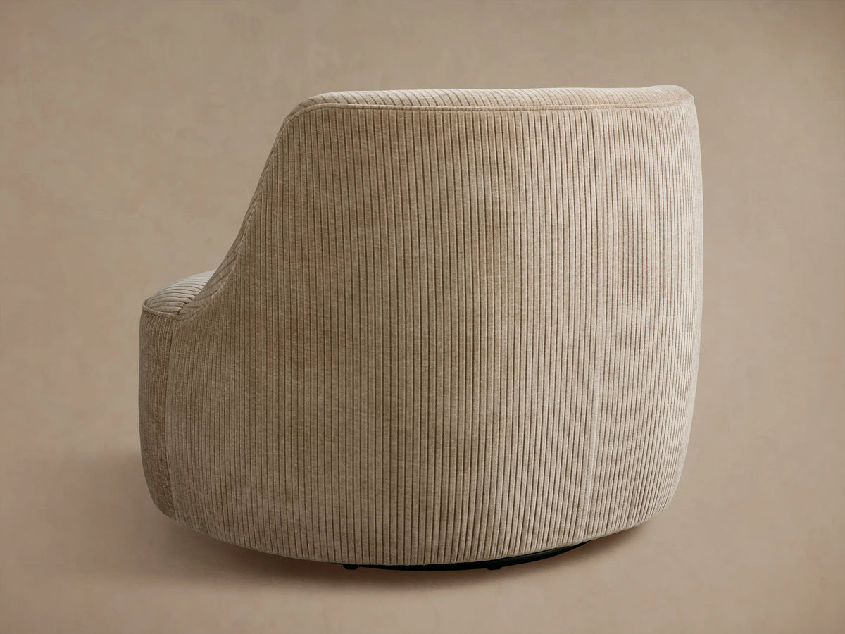 Close-up of a Sonny Swivel Chair in light beige corduroy fabric with prominent vertical ribs on the back and seat.