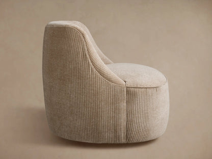 Back view of a beige ribbed Sonny Swivel Chair, slightly angled right, against a neutral light brown background.