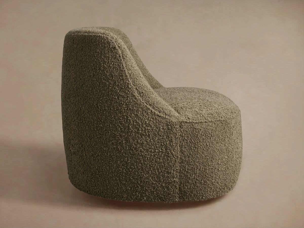 Sonny Swivel Chair, rounded barrel-style with olive green bouclé fabric, viewed from the back-right on a neutral background.