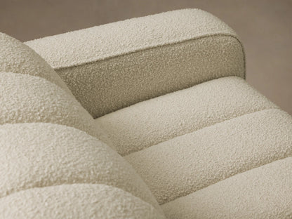 Front view of the light beige Bracco Three-Piece Chaise Sectional, featuring vertical channel tufting and a left-facing chaise.