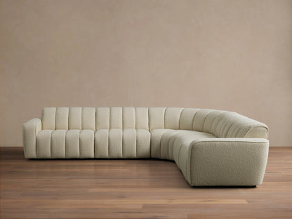 Front view of the cream Bracco Five-Piece Corner Sectional, an L-shaped sofa with channel tufting and textured fabric.