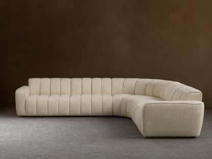 Front view of the cream Bracco Five-Piece Corner Sectional, an L-shaped sofa with channel tufting and textured fabric.