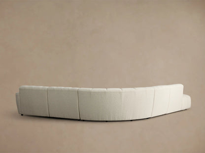 Close-up of the light beige boucle texture on the Bracco Five-Piece Bumper Sectional, showing vertical channel tufting.